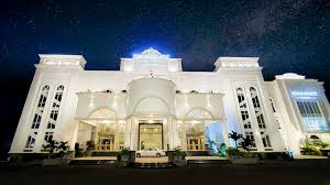 Eros Palace Luxury building facade at night