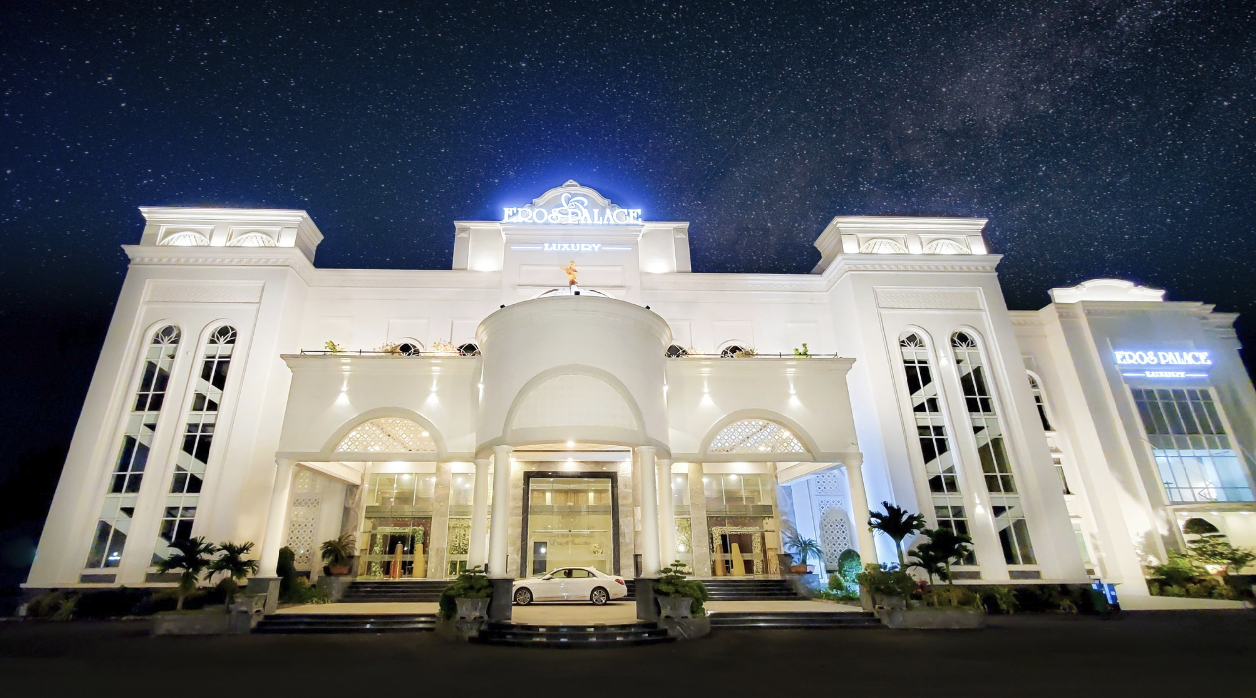 Eros Palace Luxury building facade at night