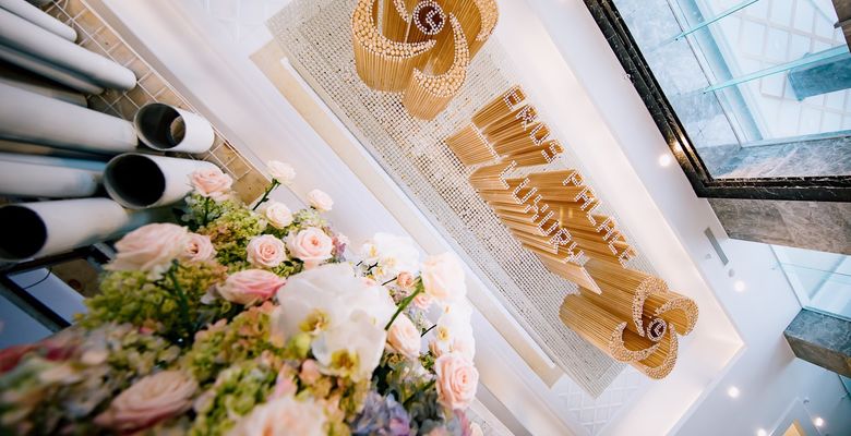 Eros Palace Luxury entrance signage with floral arrangement