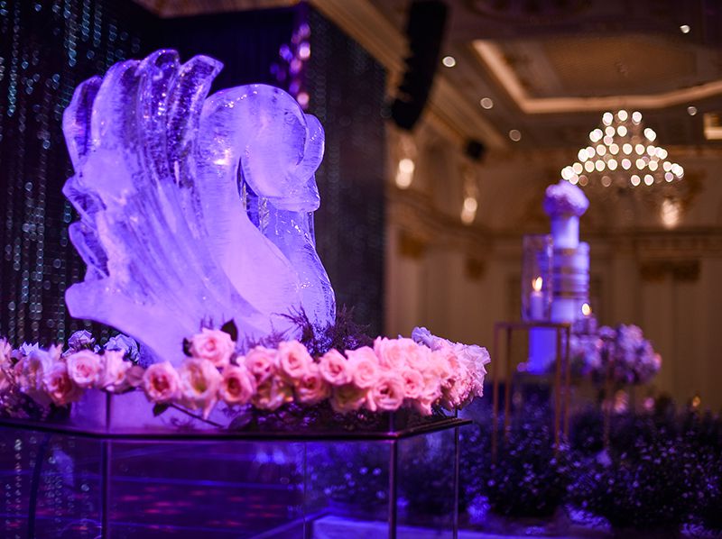 Wedding decor with ice sculpture and floral arrangement at The Mira Central Park